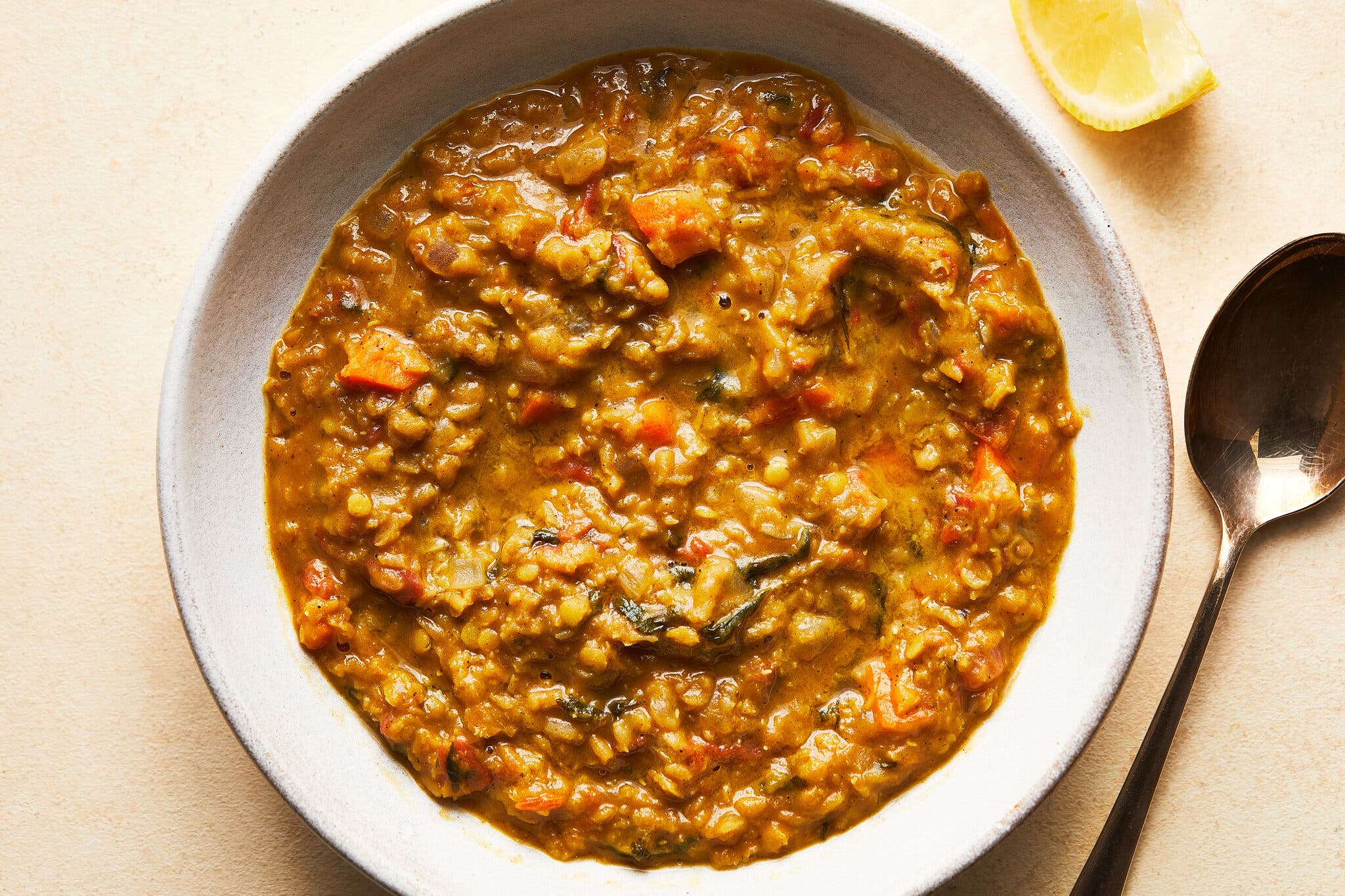 An overhead image of a chunky lentil soup.